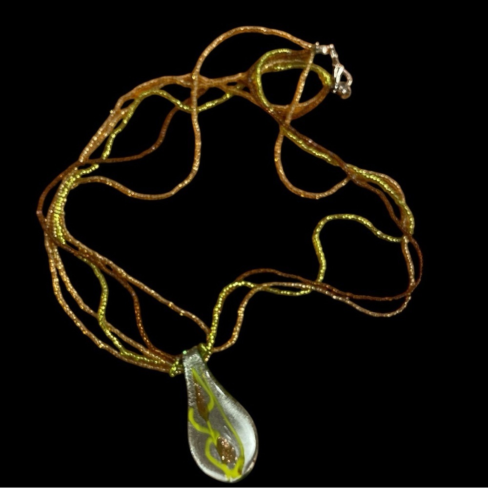 Venetian type green/gold glass pendant on four strand beaded necklace